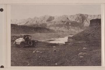 Automobile on road to Lees Ferry.  Hopkins driving down the dugway