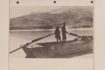 Bessie and Glen Hyde at Lees Ferry in the scow "Rain in the Face." [same image as V040/0065]