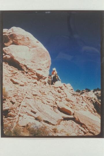 Dock Marston riding down into Navajo Canyon