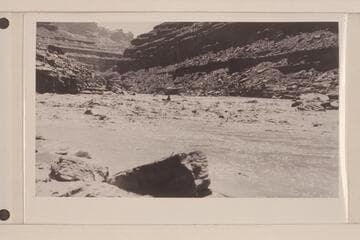 Loper shooting rapids above Slickhorn; at portage