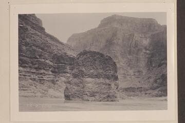 Monolith of lava in river.  Grand Canyon.  Lava Pinnacle, Nigger Head, Vulcans Anvil a mile above Lava Falls.  Approximately Mile 178 1/2