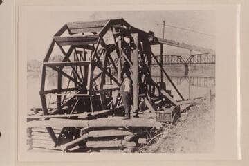 Water wheel just below railroad bridge.  Green River at Green River, Utah