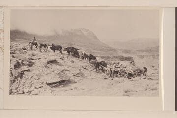 Moving the first load of camp equipment along the rim between Nakai Canyon and Spencer's camp