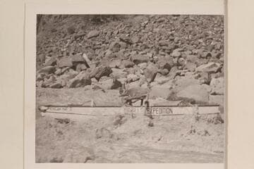 Hugh Cutler at the oars of the "Mexican Hat II" in Dubendorff Rapid.  Hugh appears to be using the oars for braking speed