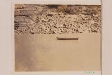 The boat abandoned at camp at Mile 177.7 left bank.  Dusty Dozen cruise