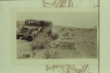 Bus en route to Marble Canyon bridge dedication.  Between Cameron and the bridge.  Print from the Freeman collection