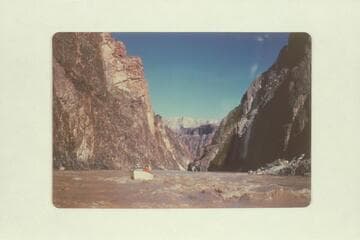 Bob Rigg piloting Chris-Craft kit boat at foot of Grapevine Rapid.  Bright Angel gauge:  67,300 cfs., the peak for the year