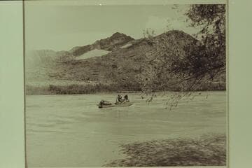 The "Esmeralda" starts down the Canyon in 1949.  Lees Ferry.  Left to right:  Robinsln; Taylor; Hudson; Marston; Edward Hudson is back of his dad.  National Park Service photo