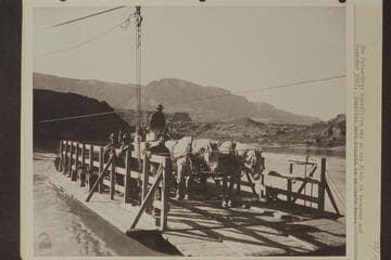 The Pathe-Bray Expedition was on the river in November and December 1927.  Supplies were brought in at Lees Ferry and transported across the river in the manner shown here.  The man nearest the camera operated the ferry