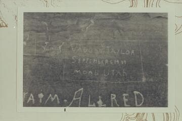 Inscription at lower end of Beaver Bottom in cave of White Rim Formation