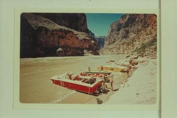 The "Big Red" hauled onto the beach for replacement of the thrust bearing which burned out at Mile 164.  Hundred Sixty-four Mile Canyon