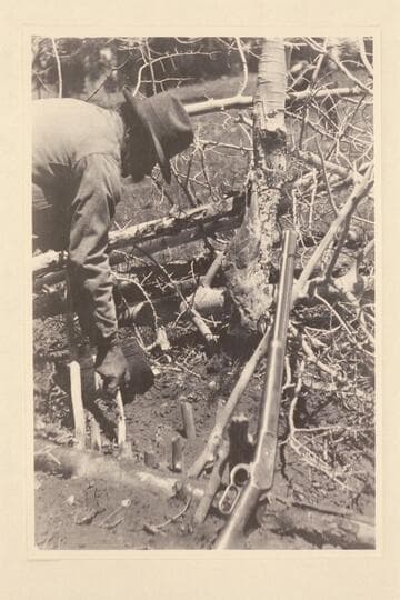 Nathan Galloway setting a bear trap near Panguitch Lake