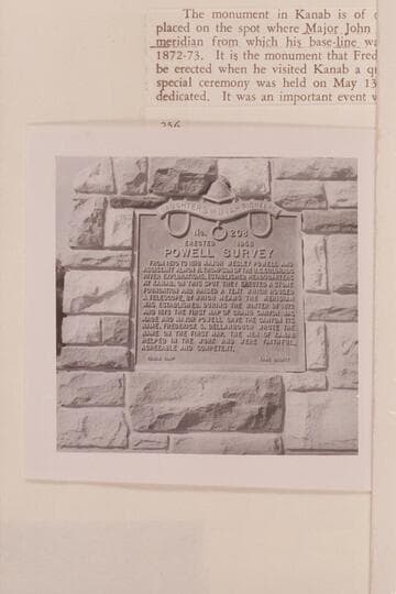 Plaque on monument with reference stone.  Old tithing lot at Kanab