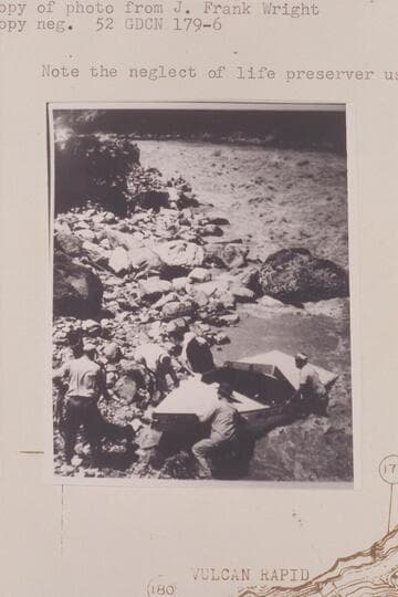 Wright-Rigg crew portaging at Vulcan Rapid,  Note the neglect of life preserver use
