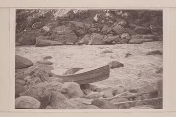 Buzz Holmstrom's boat being portaged at Vulcan Rapid