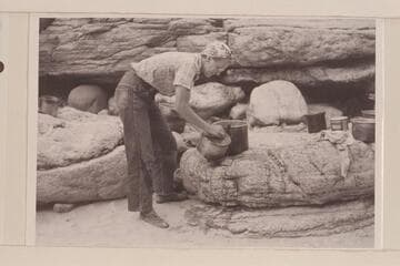 Millie Baker scrubs the pots at camp at mouth of Supai