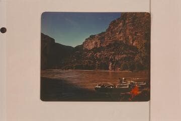 Boats and campfire at camp at Alcove Brook