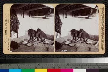 Two Hopi women are grinding corn, with flour in bowls in front of them