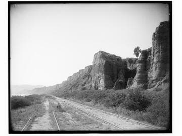 Railroad tracks and bluff along Santa Monica beach, California