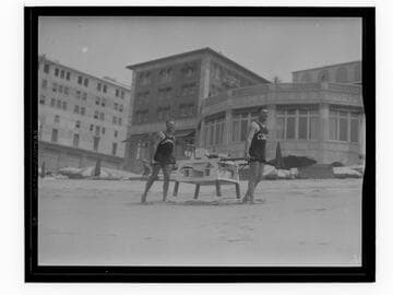 Lifeguards in training carrying equipment, Santa Monica