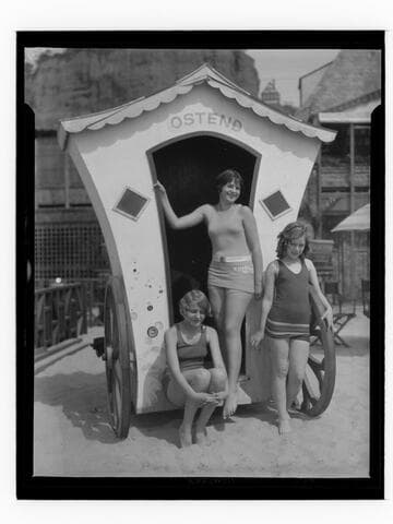 Girls posing with a hut on the beach at the Gables Beach Club, Santa Monica