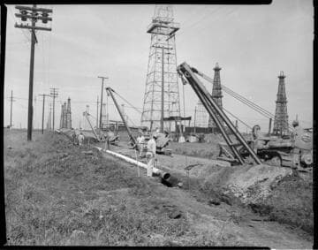 Pipe installation through an oil field