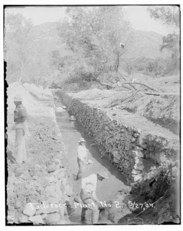 A construction crew working on the tail-
