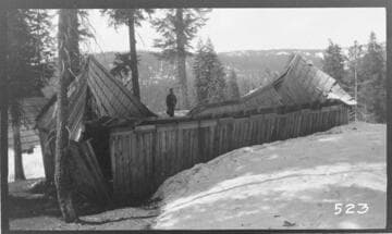 A wooden shack in a snow scene at Wolverton Reservoir