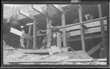 A man repairing a break in the conduit at Kaweah #3 Hydro Plant