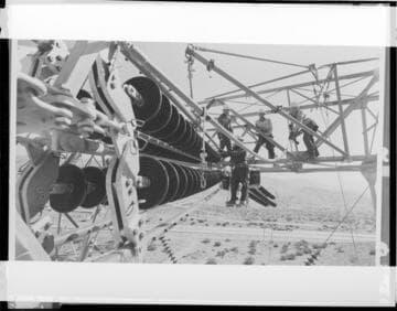 Linemen using "shepherds hook"