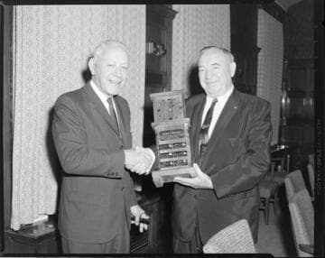 Harold Quinton gives award to Elmer P