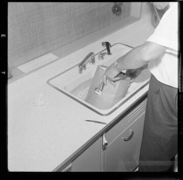 Man working electronics in a kitchen