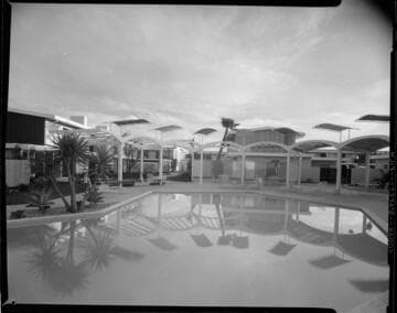 outdoor lighting around pool area at a Ramada Inn