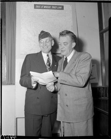 Two men looking at document