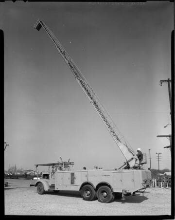 Various linemen's trucks, pole caddy, and conductor spool trailer with 11 variants