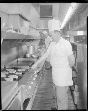 Chef grilling steaks