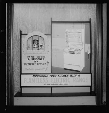 Display promoting modern electric ranges & exterior views of "The Buckingham" a planned apartment community