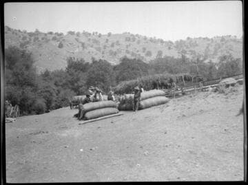 Yokuts Indians with bales of wool. Tule River Reservation, 50 miles from Porterville, California
