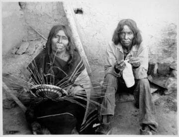 Hopi woman making basket and man crocheting