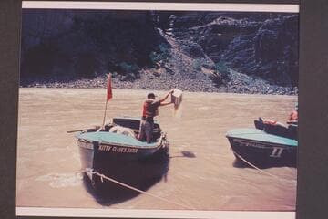Vee Bodrero bails the "Kitty" after her run of Vulcan Rapids; approximate gauge 23,000 cfs