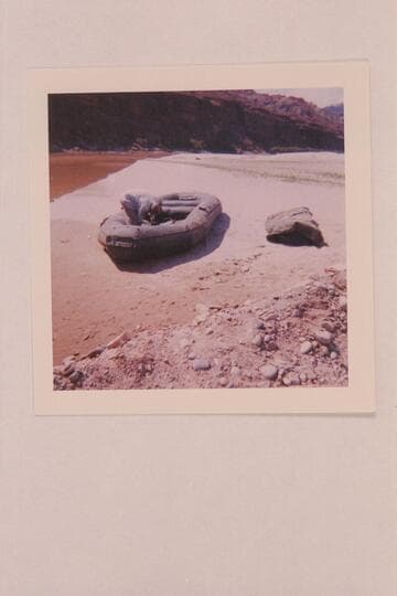 Harry Aleson inflating his 10-man at hite for a run to Cane Creek with three passengers