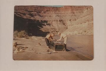 Jack Frost and F. A. Thurman repairing the bottom of the "Moenkopi" during San Juan trip