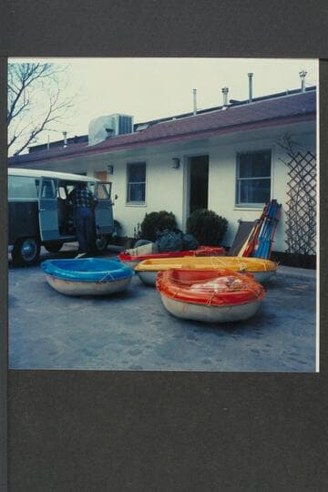 Bill Belknap unloading Sportyaks and gear from the Volkswagon; Moab