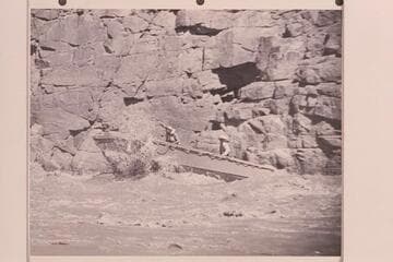 A single motored 18 foot aluminum hull running one of Grand Canyon's rapids.  The power unit was 25HP