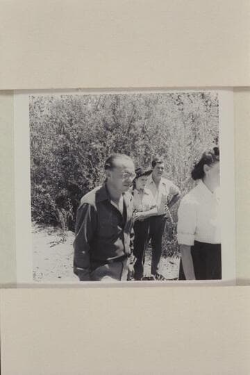 Pres Walker and others watching the landing of the Nevills river party.  Jensen
