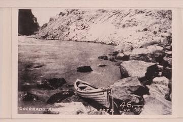 Portion of Photo No. 54 of Brown Survey in Cataract Canyon.  Shows the type of boat provided by Brown for the traverse of Cataract Canyon, Glen, Marble, and the Grand Canyons.  At head of Rapid No. 23; Mile 202.20, Cataract Canyon