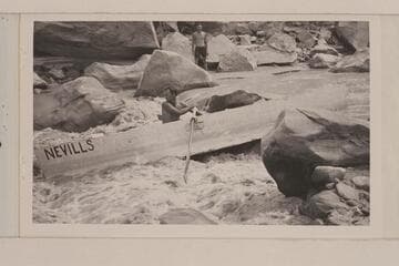 Kent Frost watches Norm Nevills in his early rock-dodging on the San Juan River in 1938