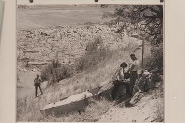 Loper's wrecked boat near Mile 41 in Marble Canyon.  Edward Hudson at left; Ed Hudson and Willie Taylor at right