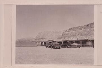 The "Step In Again" on the trailer at left and the "Twin" on the truck.  The "June Bug" on the trailer at right and Art Greene's "Cliff Dweller's Lodge"