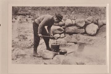 Emery Kolb cooking at Rust Camp on Bright Angel Creek.  "Little bit posed" (Dave Rust, Provo, 1955, Sep. 29)